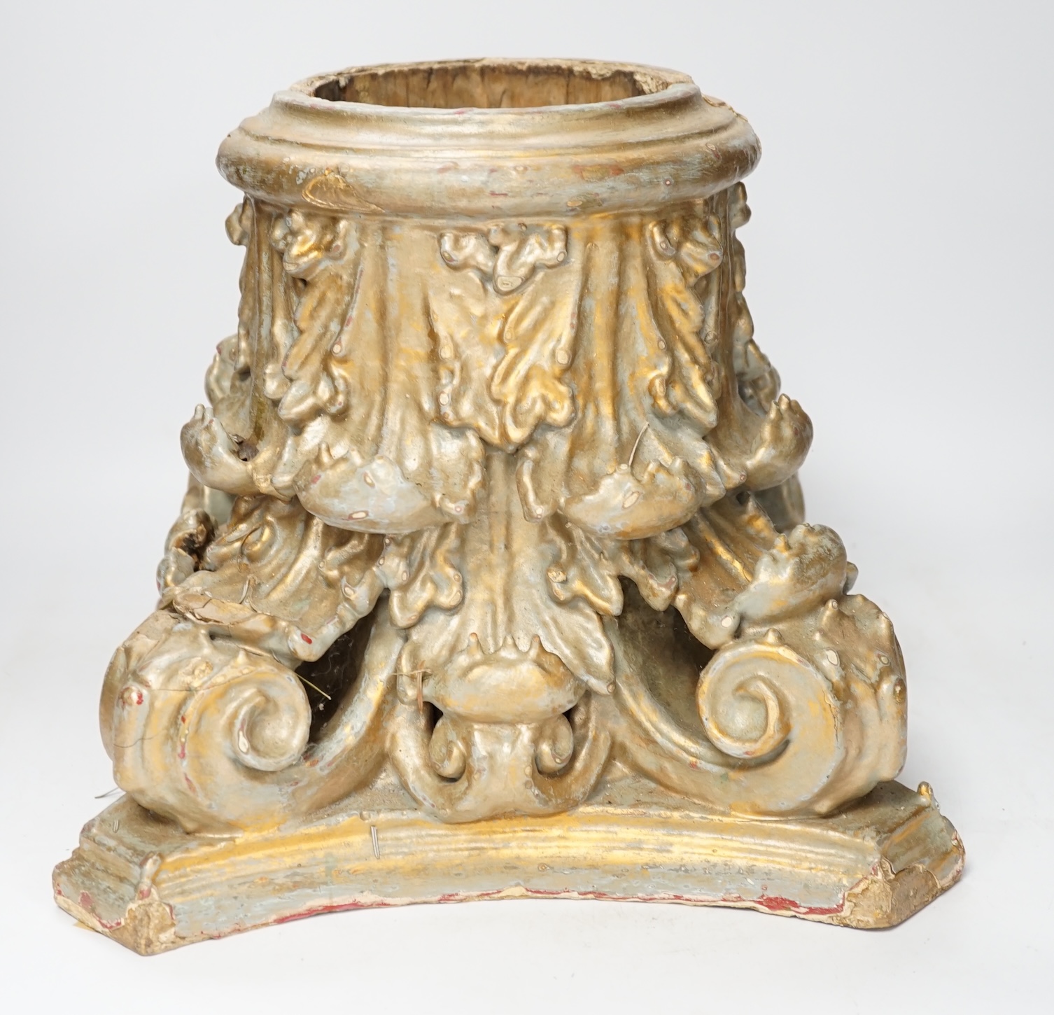 A carved wood and gesso gilt column base in two sections, 28cm high. Condition- fair